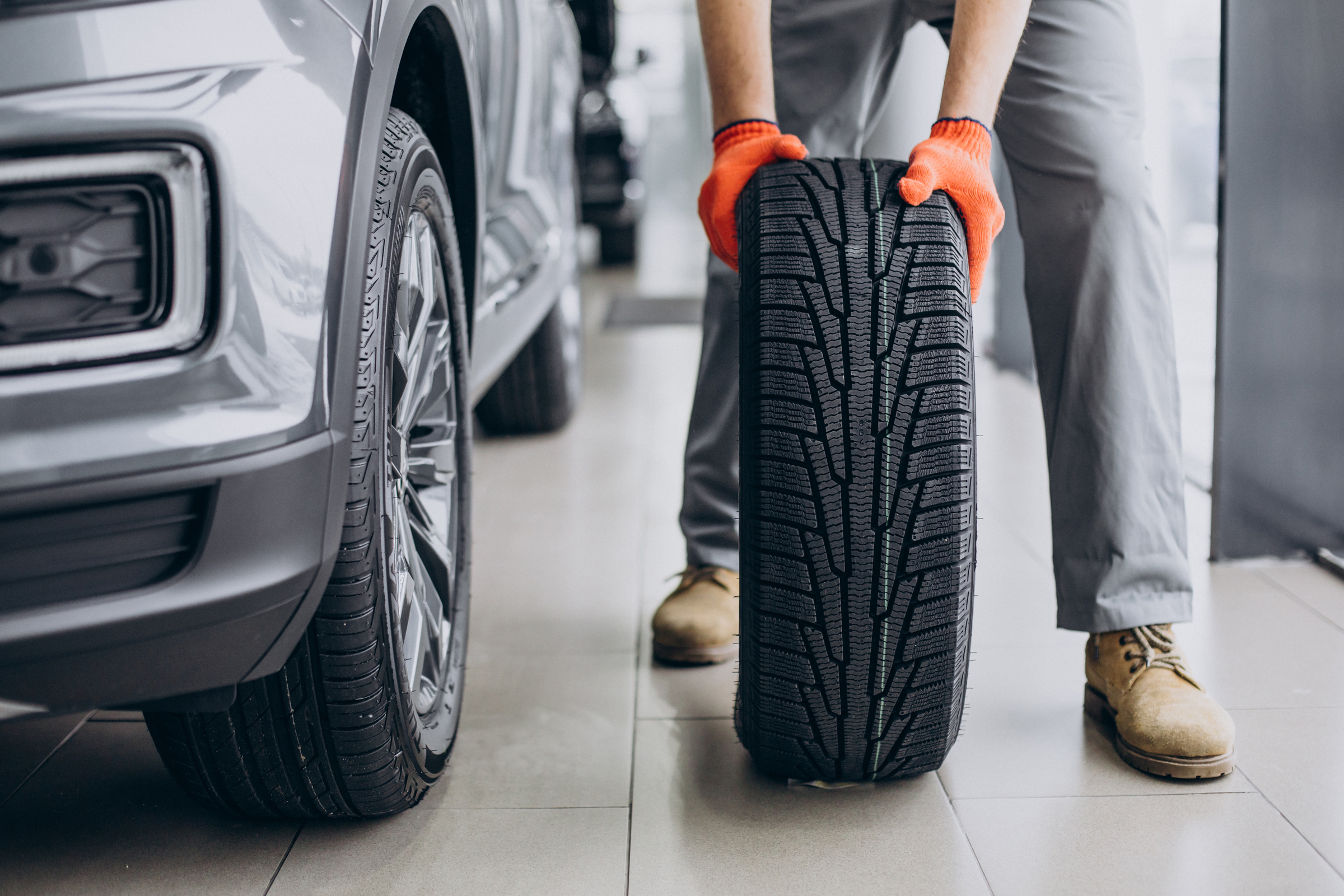 mechanic changing tires car service 1